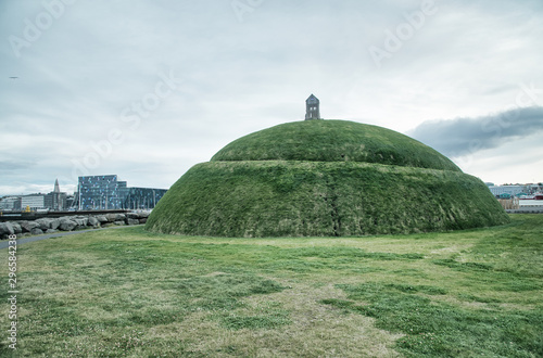 Thufa hill in Reykjavik with city skyline on background photo