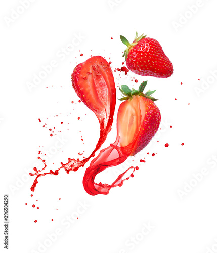 Juice splashes out from cutted strawberries on a white background photo