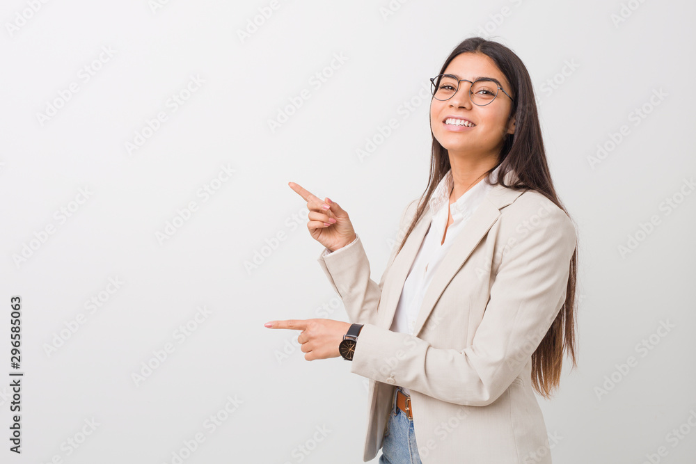 Young business arab woman isolated against a white background excited pointing with forefingers away. Young business arab woman isolated against a white background excited pointing with forefingers away.
