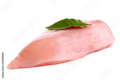 Whole uncooked boned chicken breast with bay leaf isolated on white.