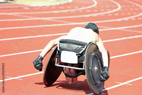 young athlete on wheelchair during a race photo