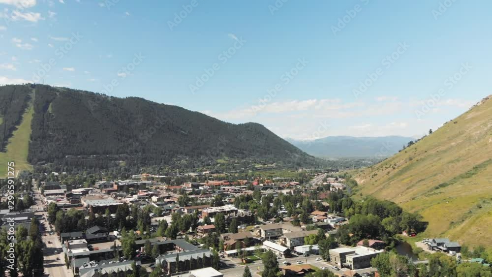 Panoramic aerial view of Jackson Hole homes and beautiful mountains on a summer morning Panoramic aerial view of Jackson Hole homes and beautiful mountains on a summer morning