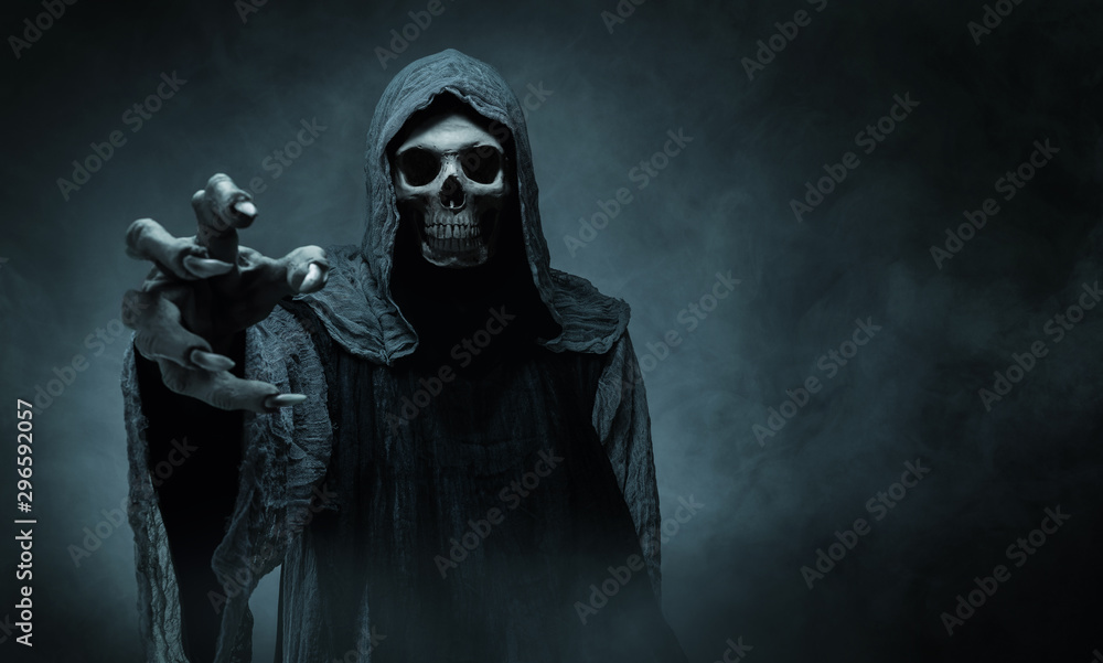 Grim Reaper extending arm towards camera against dark background with space  to add text. 27100533 Stock Photo at Vecteezy