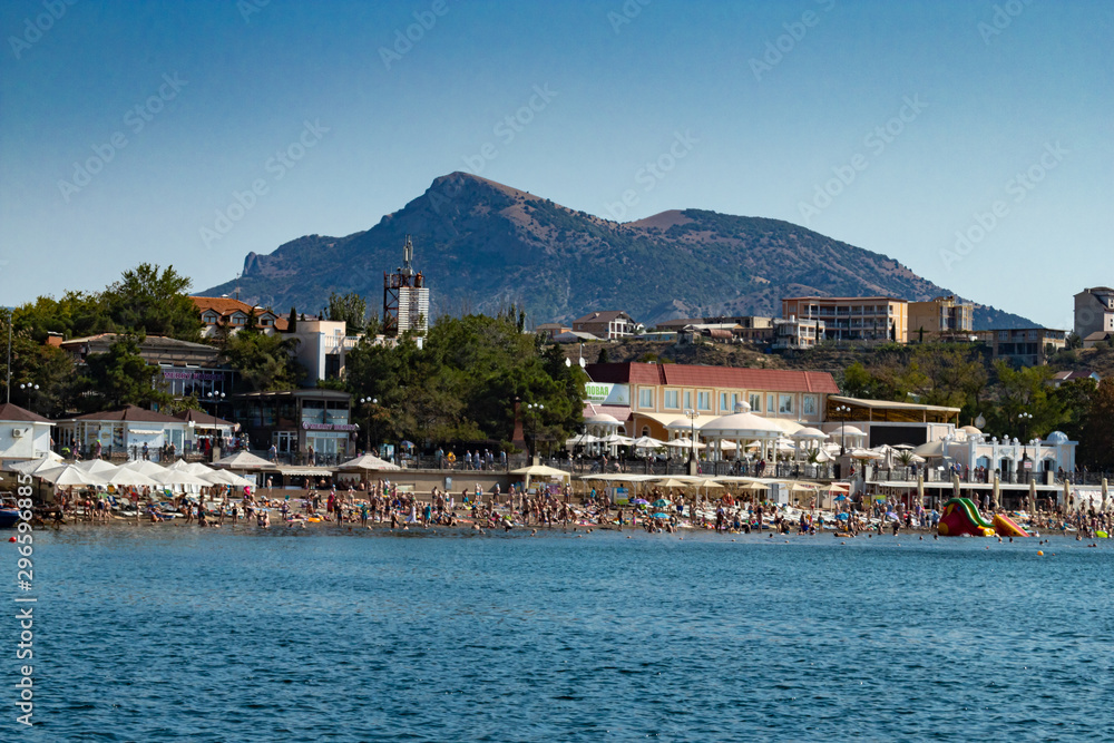 crowded city beach of Sudak in Crimea in summer