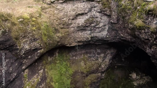 Sumgan-Kutuk karst cave. Descent cavers in the cave. Aerial view.