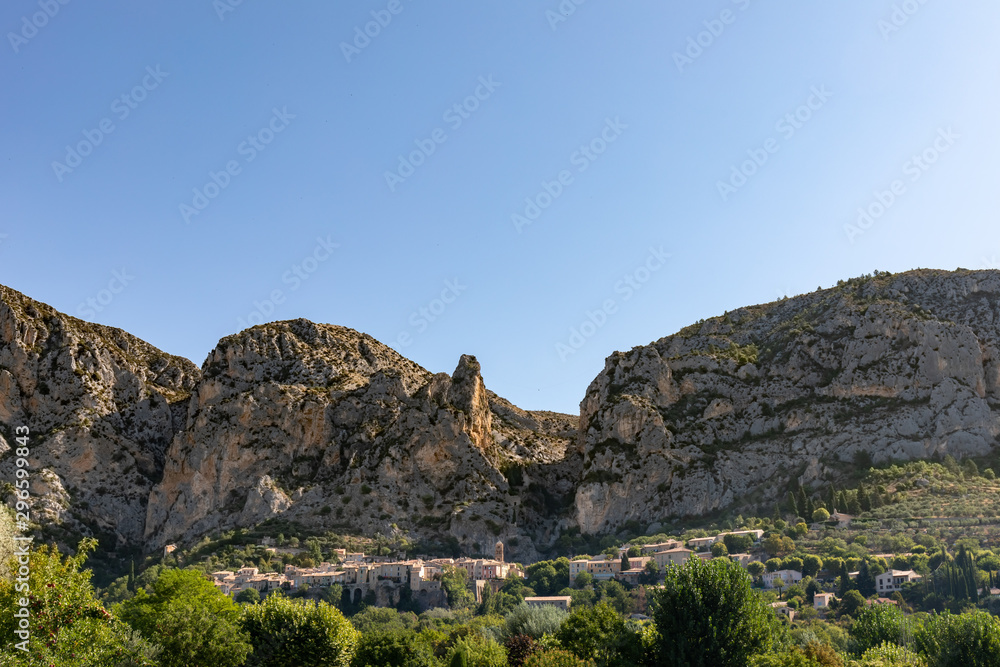 Moustiers Sainte Marie, Alps, France - The village under the rocks Moustiers Sainte Marie, Alps, France - The village under the rocks