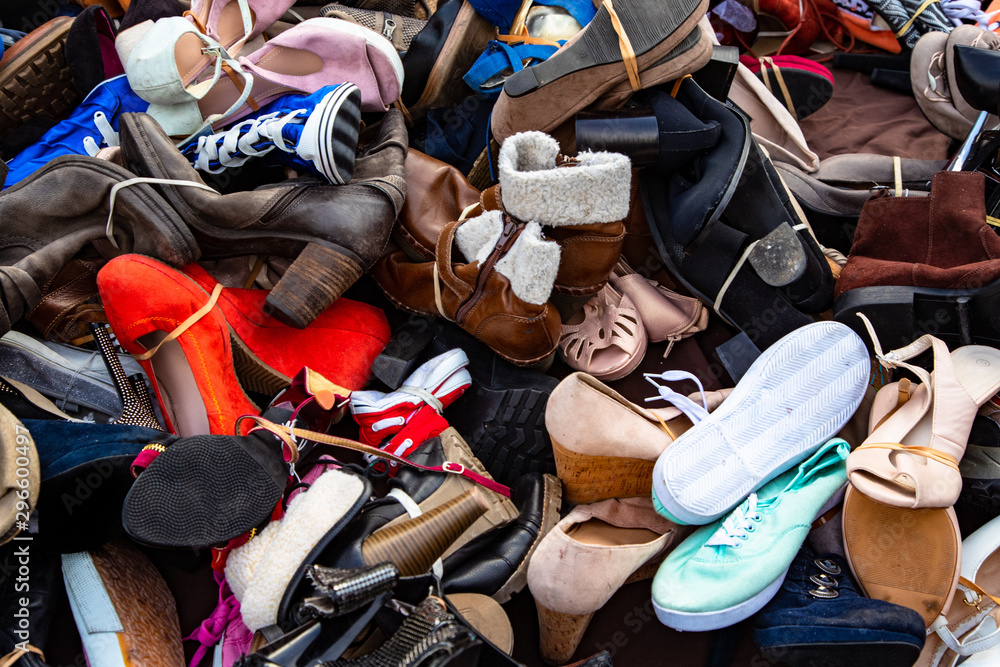 Pile of used shoes for sale at montreuil street market in Paris, France  Stock Photo | Adobe Stock
