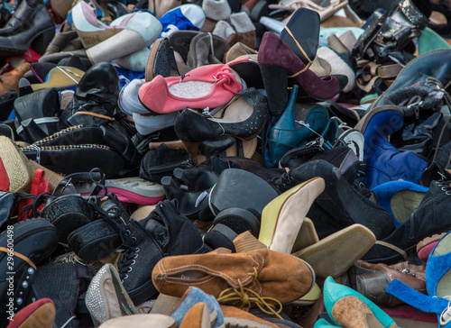 Pile of used shoes for sale at montreuil street market in Paris, France