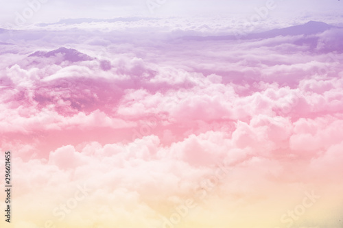 beautiful fantasy pastel clouds againt with top of hill as paradise background