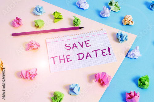 Text sign showing Save The Date. Business photo text reserve the mentioned future wedding date on their calendar Colored crumpled papers empty reminder blue yellow background clothespin © Artur