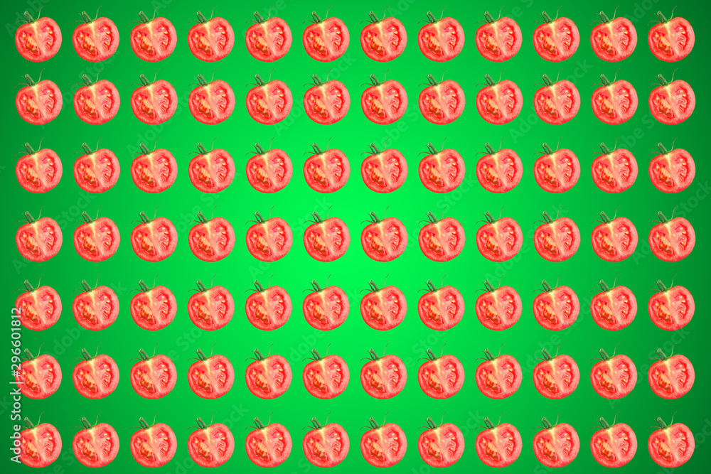 Vegetable pattern of red tomatoes sliced on green background. Vegetable pattern of red tomatoes sliced on green background.