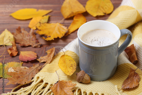 Autumn composition with leaves and a cup of coffee.