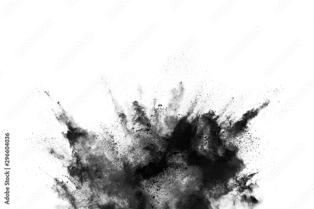 Closeup of black dust particles explode isolated on white background.. Closeup of black dust particles explode isolated on white background..