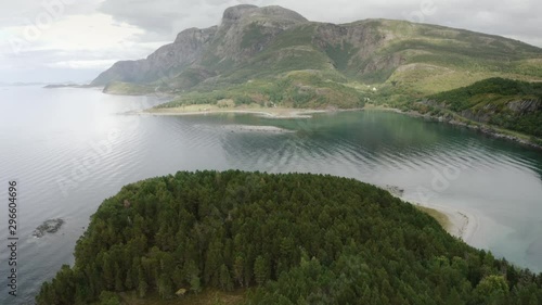 Aerial drone view island with coniferous forest and mountains above sea landscape travel rural scenery in Norway photo