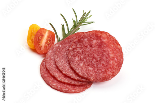 Salami sliced. Raw smoked sausage slices with herbs, isolated on white background