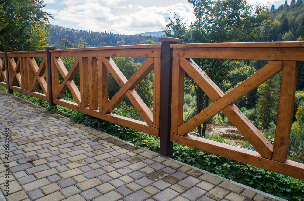 Obraz premium Wooden fence. Yellow square planks of logs.