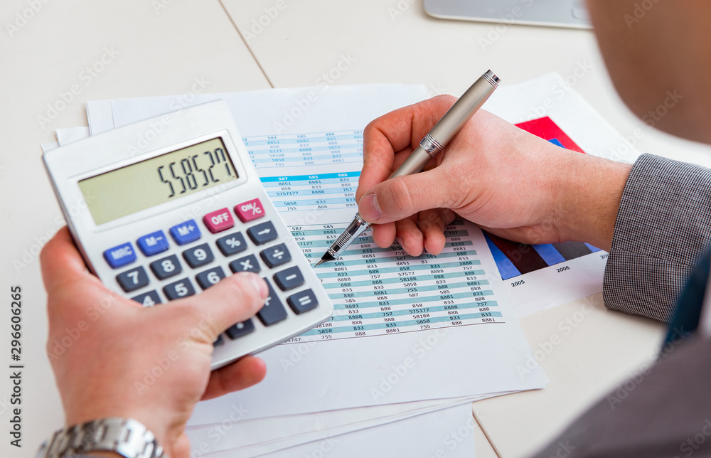 Finance analyst looking and financial reports Finance analyst looking and financial reports