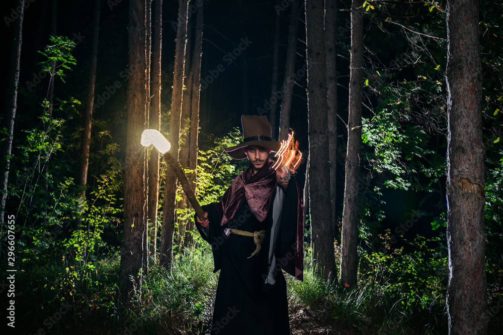 Wizard with a glowing staff casting a spell