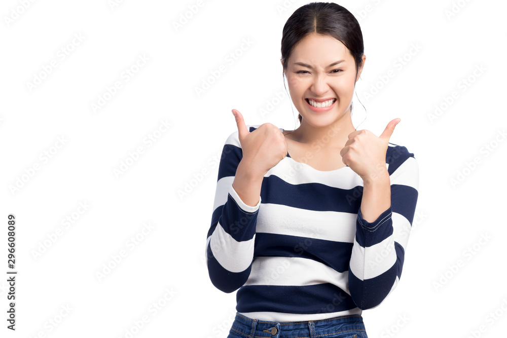 Young happy Asian woman raising her thumbs with winner success expression isolated on white.