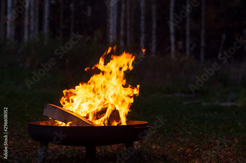 Campfire in a firebowl, autumn evening