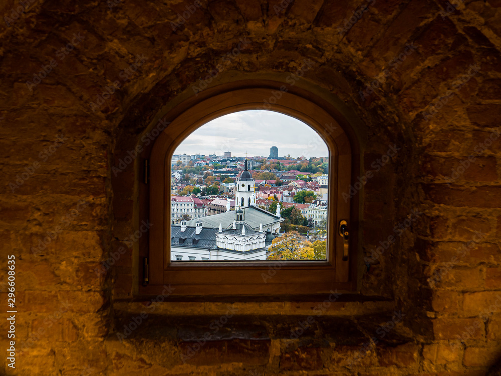 View through a window in historc Gediminas tower on mansion in Old Town of Vilnius Lithuania