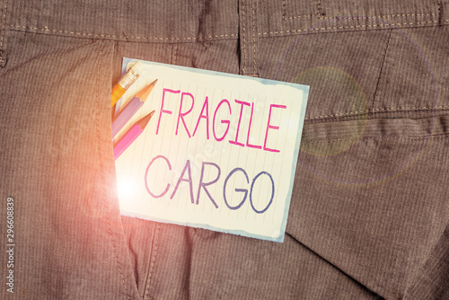 Handwriting text Fragile Cargo. Conceptual photo Breakable Handle with Care Bubble Wrap Glass Hazardous Goods Writing equipment and white note paper inside pocket of man work trousers