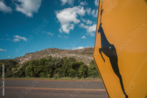 Deer road sign in Brazilian countryside, Serro, Minas Gerais, Brazil photo