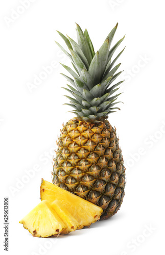 Tasty raw pineapple with slices on white background