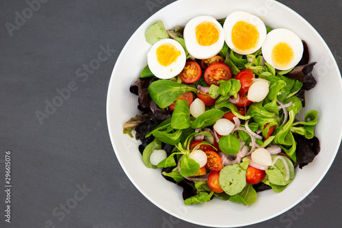 Salad egg mixed with spinach tomatoes, meal food delicious diet for healthy.
