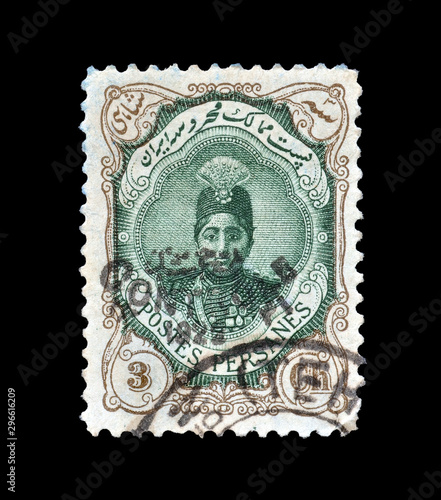 Cancelled postage stamp printed by Persia, that shows Ahmad Shah Qajar in an ornament frame, circa 1922. photo