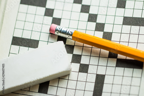 Overhead Angle of  a Pencil and Eraser on Top of a Crossword Puzzle