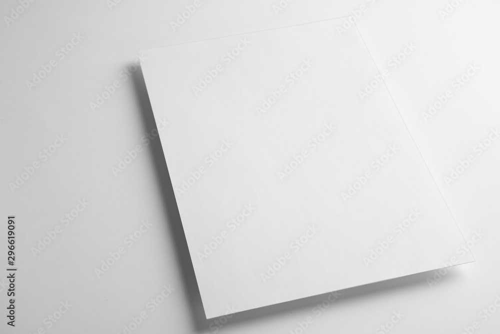 Blank paper sheet on white background. Mock up for design Blank paper sheet on white background. Mock up for design