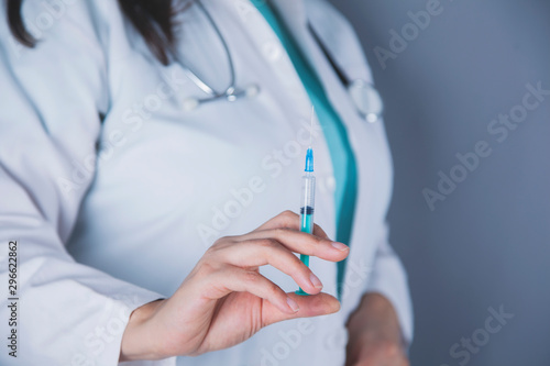 woman doctor hand syringe