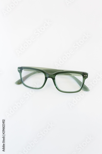 Modern green glasses on white background