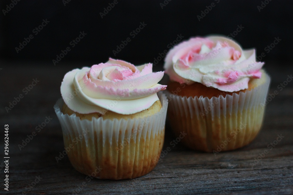 Delicious cupcakes with cream on the table