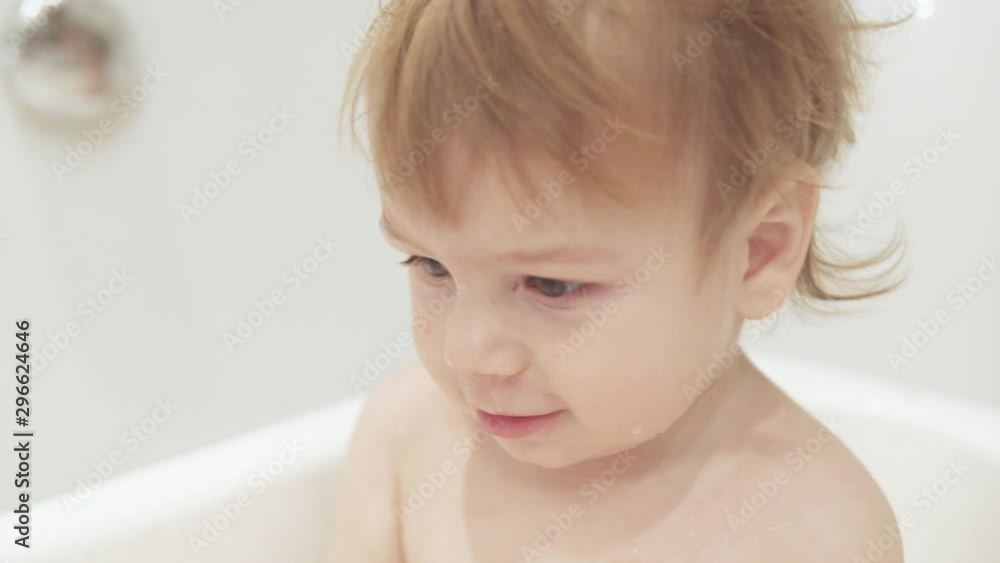 Baby boy bathes in the bathroom Baby boy bathes in the bathroom