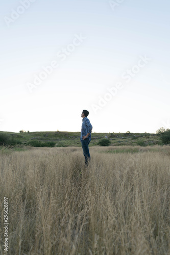Standing man in natural environment at a sunny afternoon © Irvin Cardona
