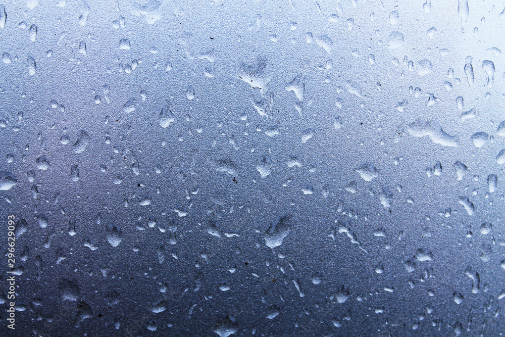 Large raindrops on a metallic silver surface. Texture for creative design. Large raindrops on a metallic silver surface. Texture for creative design.