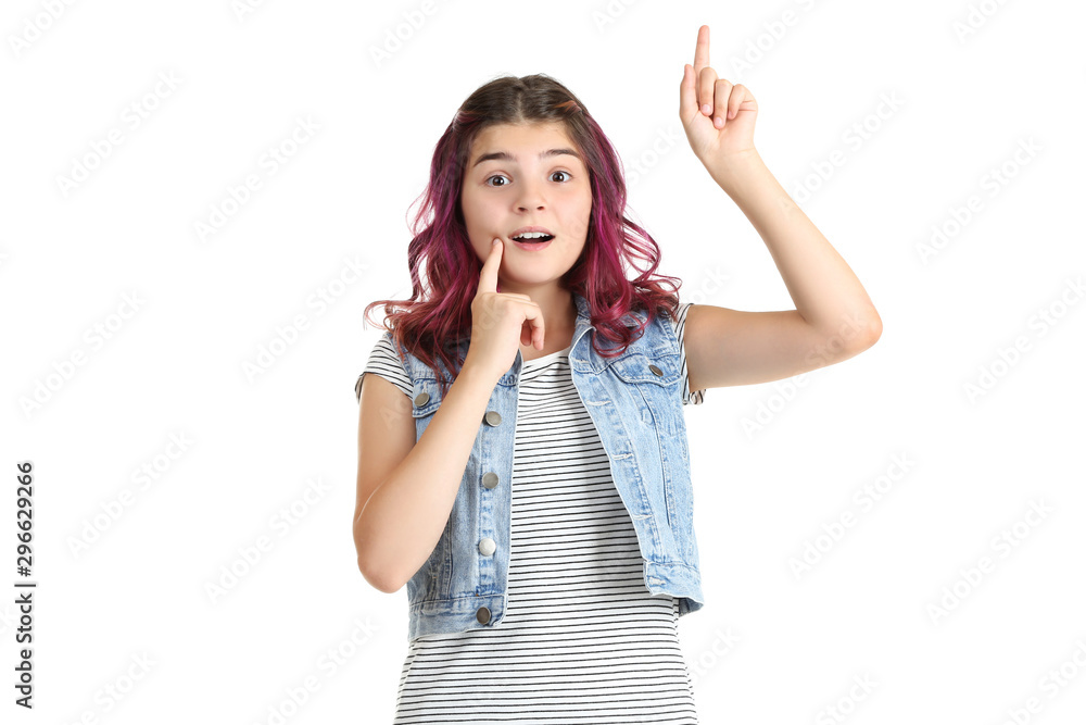 Beautiful young girl showing finger up on white background Beautiful young girl showing finger up on white background