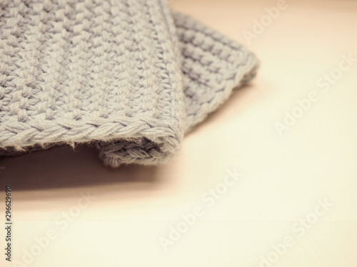 piece of knitted fabric on white background for text