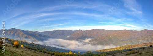 Panorama of the city among the mountains in the fog