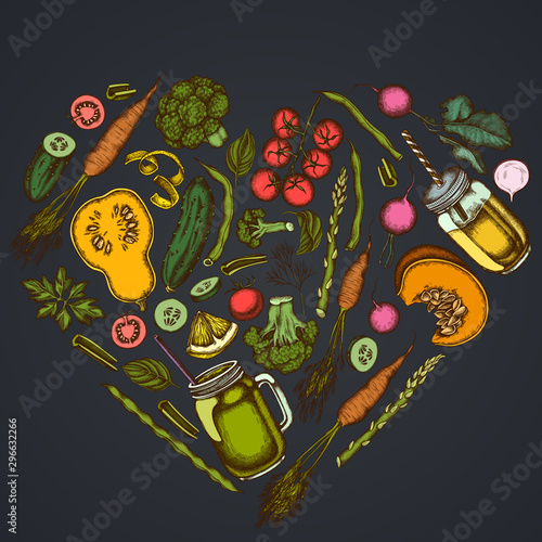 Heart floral design on dark background with lemons, broccoli, radish, green beans, cherry tomatoes, beet, greenery, carrot, basil, pumpkin, smoothie cup, smothie jars, cucumber, celery