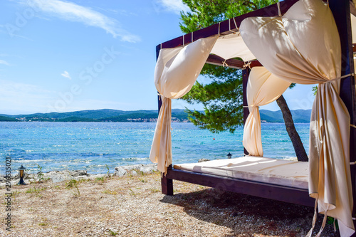 Fototapeta Naklejka Na Ścianę i Meble -  Canopy Bed Beach.