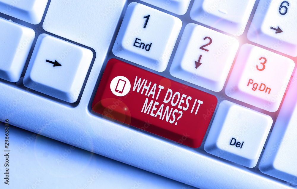 Text sign showing What Does It Means Question. Business photo text asking meaning something said and do not understand White pc keyboard with empty note paper above white background key copy space Text sign showing What Does It Means Question. Business photo text asking meaning something said and do not understand White pc keyboard with empty note paper above white background key copy space
