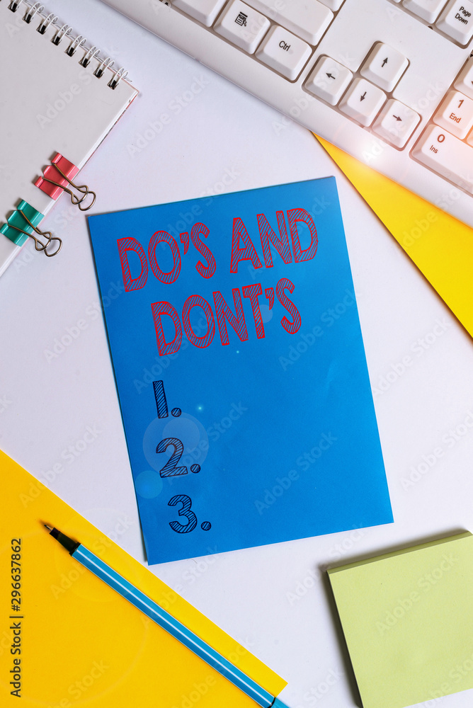 Conceptual hand writing showing Do S And Dont S. Concept meaning Rules or customs concerning some activity or actions Colored paper binder clip sheets white desk empty space Conceptual hand writing showing Do S And Dont S. Concept meaning Rules or customs concerning some activity or actions Colored paper binder clip sheets white desk empty space