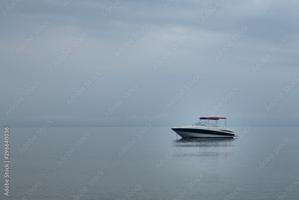 Motor boat, yacht on the surface of calm sea
