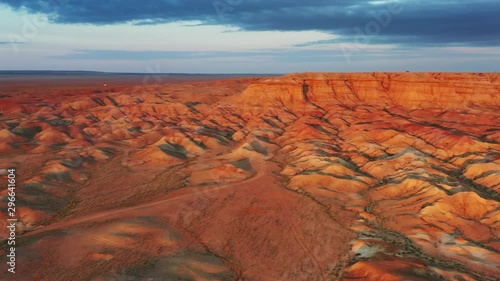 Aerial panorama of textural colorful striped canyons Tsagaan suvarga - White stupa at sunrise. Ulziit soum, Dundgovi province, Mongolia, 4k photo