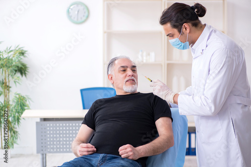 Old man visiting young doctor for plastic surgery