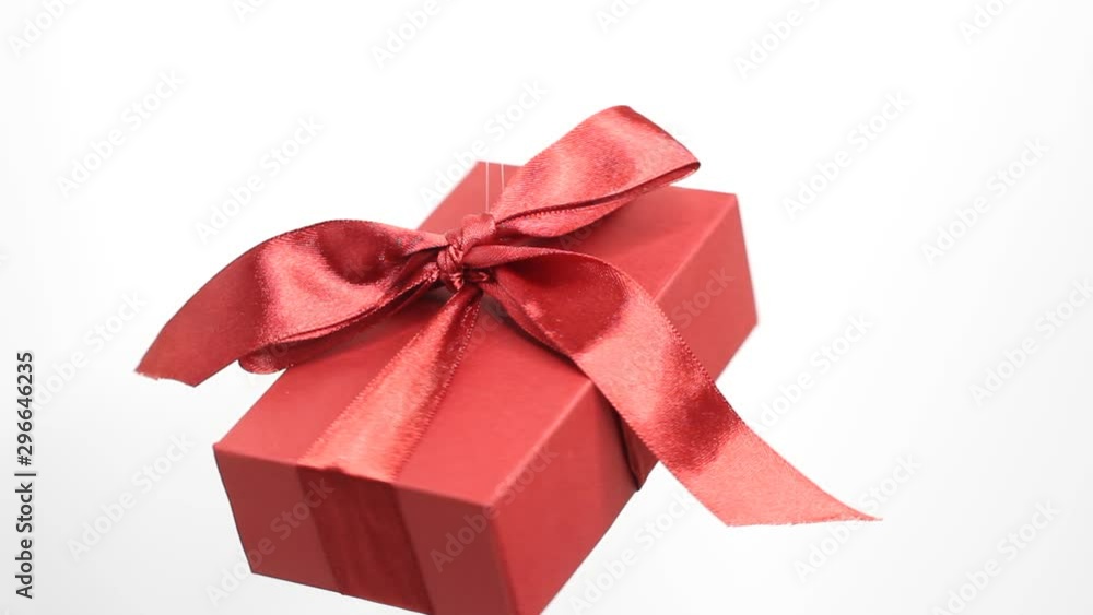 Christmas and New Year red box. Rotating decoration on white background. Merry Christmas and a Happy New Year! Christmas and New Year red box. Rotating decoration on white background. Merry Christmas and a Happy New Year!