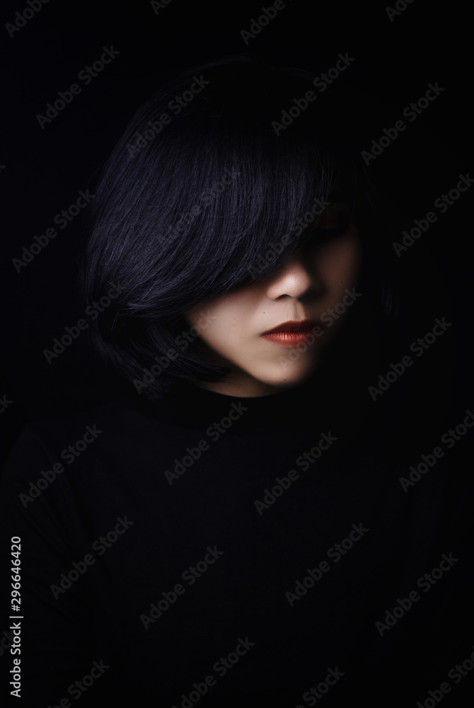 Beautiful woman, short hair, Asian face, white skin, red lipstick Wearing a black long-sleeved turtleneck sweater On a black background Beautiful woman, short hair, Asian face, white skin, red lipstick Wearing a black long-sleeved turtleneck sweater On a black background